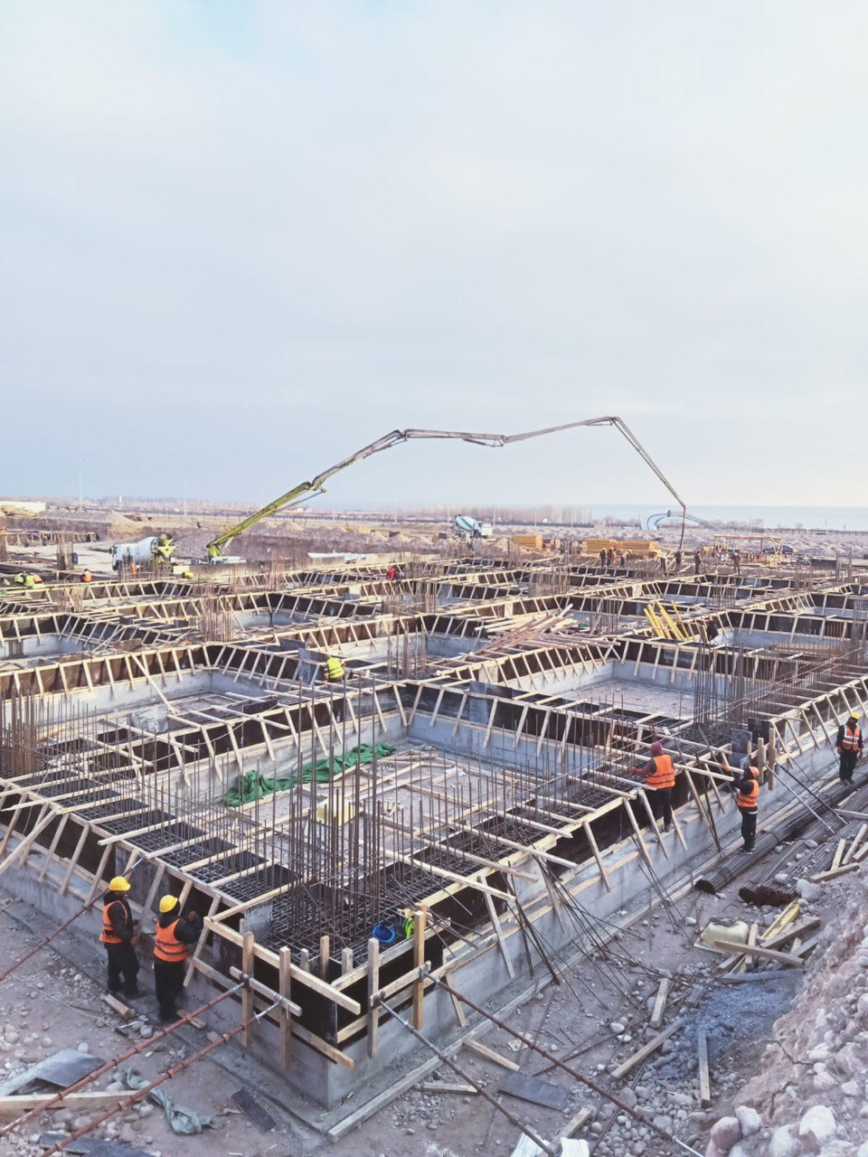Mass foundation pour — concrete boom in action
